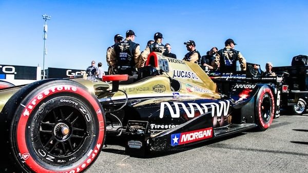 indycar series drivers posing with car