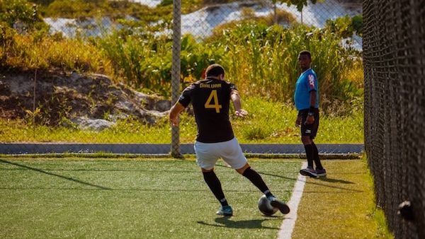 fifa soccer player kicking the ball