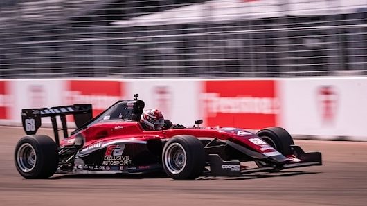 indycar series car driving on track