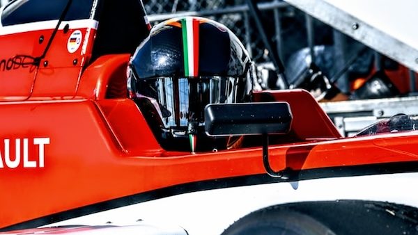 f1 driver with brand partner logo