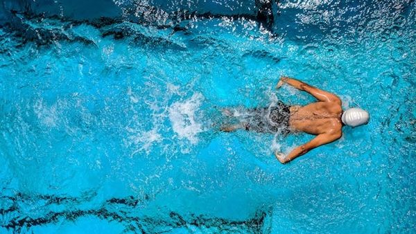 athlete swimming in pool