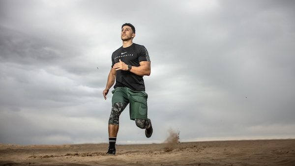 hybrid athlete running in desert