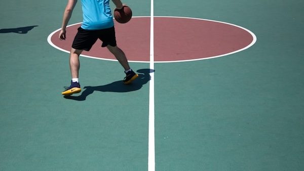 basketball player dribbling on the court