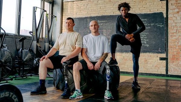 adaptive athletes posing in gym