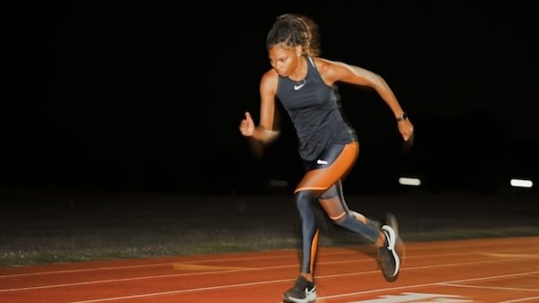 woman running on track