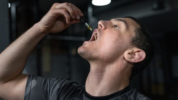 athlete ingesting cbd for recovery