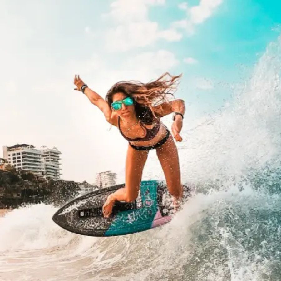 Amber Torrealba skimboarding on a wave, sports marketing agent