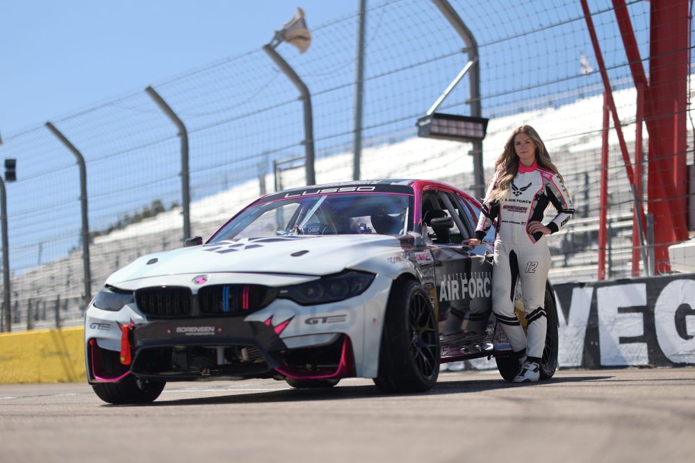 Amanda Sorensen standing next to her vehicle for Formula Drift, motorsports marketing agency