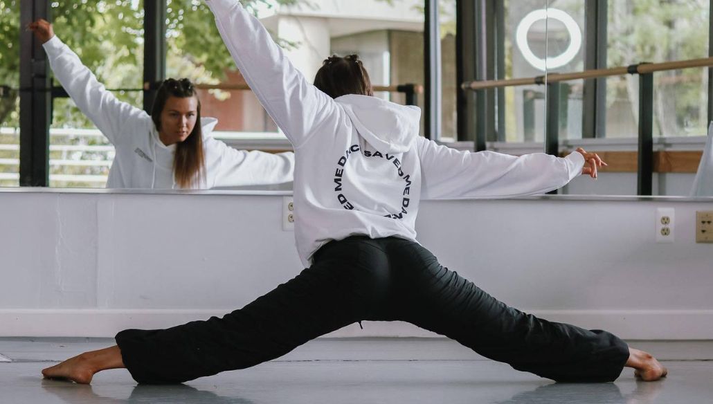 Ashley Jade Pietro dancing in front of a mirror at her studio, marketing agent for dancers